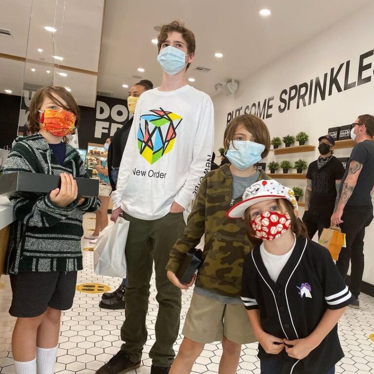 A group of kids standing inside Donut Friend