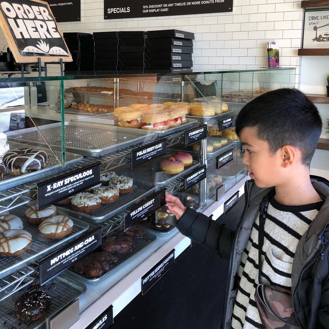 A kid choosing his donut