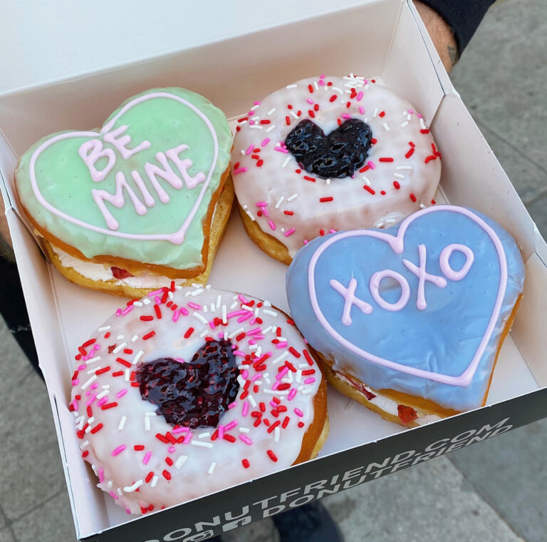 a box of four heart shaped donuts